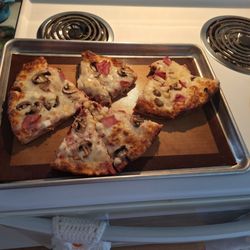 Cedar Haus - Cooking my cooked pizza
