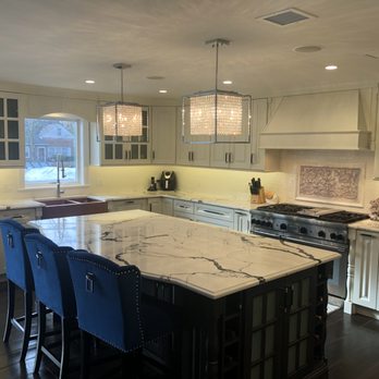 Tarr's Home Improvements - a kitchen with a marble island - General Contractors Near Me - Franklin Square, New York Tarr's Home Improvements - a kitchen with a marble island - General Contractors Near Me - Franklin Square, New York