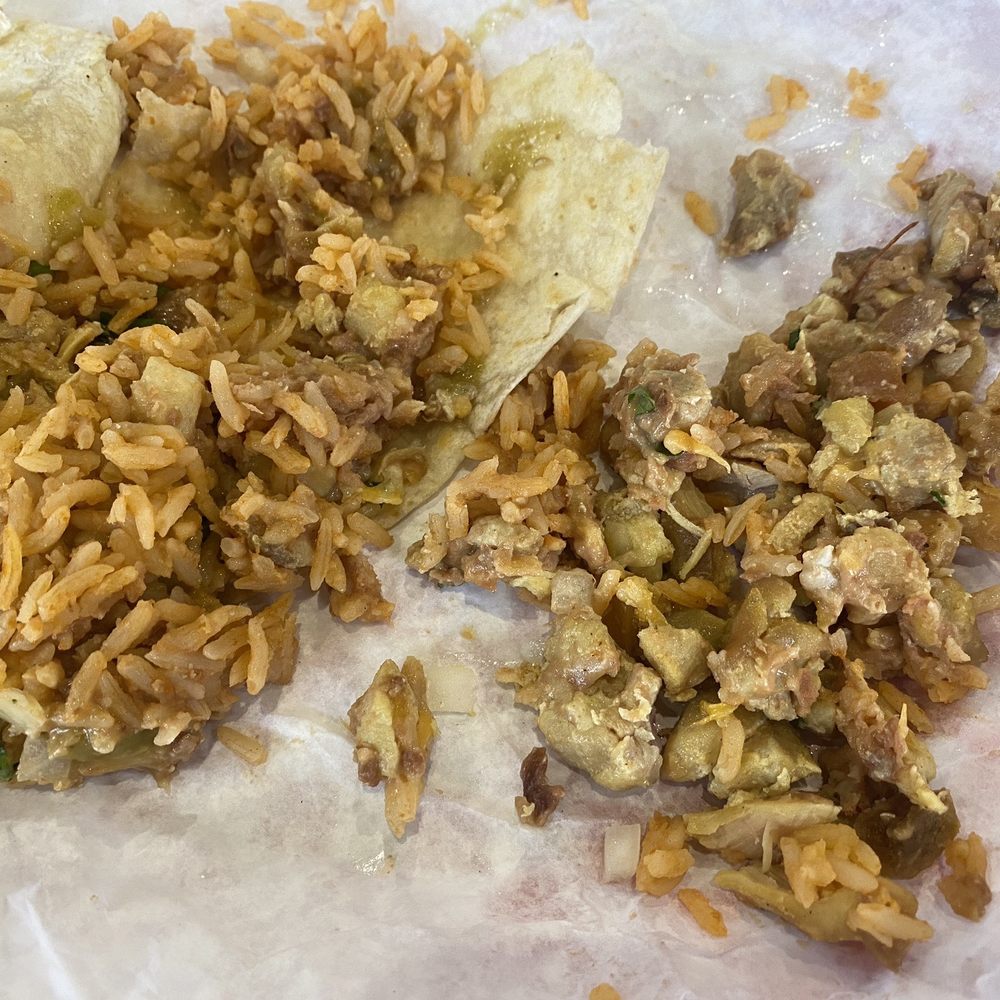 Fuego Cravings - The inside of the burrito. Hard, dark, old chicken. Where is the onion, cilantro and cheese? 13 for this!!!! - Mexican Near Me - Upland, California Fuego Cravings - The inside of the burrito. Hard, dark, old chicken. Where is the onion, cilantro and cheese? 13 for this!!!! - Mexican Near Me - Upland, California