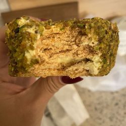 Sunflower Bakery - Pistachio sansrival (meringue cookie with buttercream rolled in pistachio). Crunchy!
