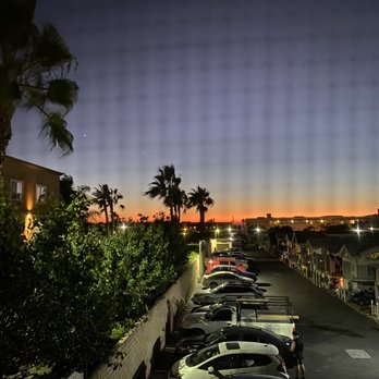 Coast Inn - View of the sunset from my bathroom window in our room at Coast Inn - Hotels Near Me - Oceanside, California Coast Inn - View of the sunset from my bathroom window in our room at Coast Inn - Hotels Near Me - Oceanside, California