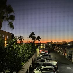 Coast Inn - View of the sunset from my bathroom window in our room at Coast Inn
