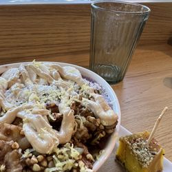 The Green Moustache Organic Café - Blueberry smoothie bowl and a piece of turmeric ginger cheesecake