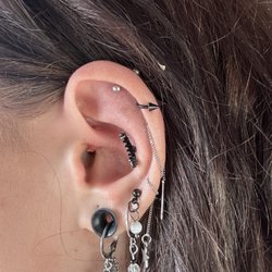 Ron & Dave's Tattooing - the removed jewelry, after forming a keloid.