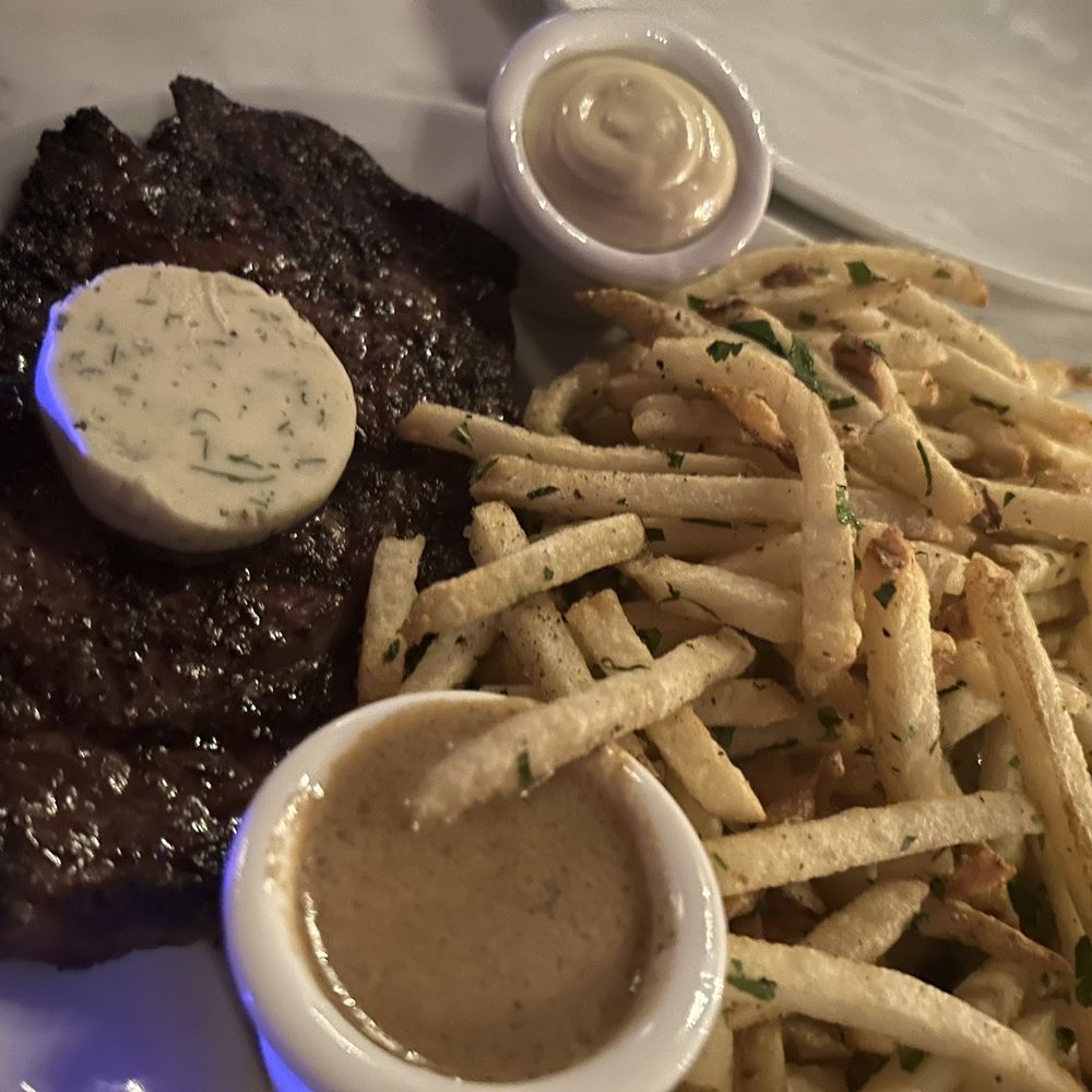 Justine's Brasserie - Steak Frites with Au Poivre Sauce - French Near Me - Austin, Texas Justine's Brasserie - Steak Frites with Au Poivre Sauce - French Near Me - Austin, Texas