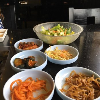 Shila Korean BBQ - Assorted Korean side dishes. They refill them as you run out. Korean pancake and potato salad included but not pictured. - Barbeque Near Me - Clovis, California