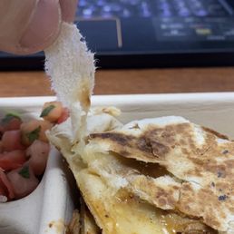 Paper towel/toilet paper stuck in my quesadilla. Paper towel/toilet paper stuck in my quesadilla.