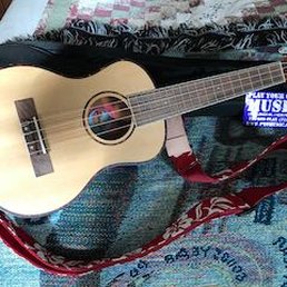 My new Amahi Soprano Ukulele with strap attached.