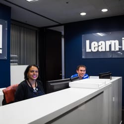Learnit - Julie and Ben at the Learn iT! front desk.