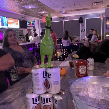 Edgewood Bar & Grill - a stack of beer cans on a table - Bars Near Me - Deer Park, New York