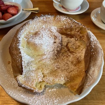 Original Pancake House - Dutch Baby Georgian's feast of a large oven-baked pancake, served with lemon, powdered sugar and fresh strawberries - Breakfast & Brunch Near Me - Williamsville, New York Original Pancake House - Dutch Baby Georgian's feast of a large oven-baked pancake, served with lemon, powdered sugar and fresh strawberries - Breakfast & Brunch Near Me - Williamsville, New York