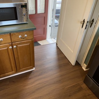 4 Elements Construction - a kitchen with wood flooring - General Contractors Near Me