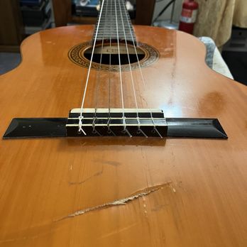 Mike Lull's Guitar Works - My 5 string guitar gift (w/"Led Zeppelin damage.") from the "Dumpster Emporium" was given 6th string at MLGW. - Guitar Stores Near Me - Bellevue, Washington