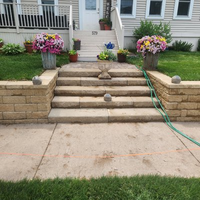 Retaining Wall and staircase, Sod and driveway - Removed an old mail box with one ton of cement around it. Removed the old cement staircase and added the new staircase and retaining wall with a small paver sidewalk leading up to the wood deck. We graded it all off and added new sod. Retaining Wall and staircase, Sod and driveway - Removed an old mail box with one ton of cement around it. Removed the old cement staircase and added the new staircase and retaining wall with a small paver sidewalk leading up to the wood deck. We graded it all off and added new sod.