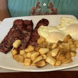 Mom's Restaurant - Two eggs and turkey bacon with house potatoes