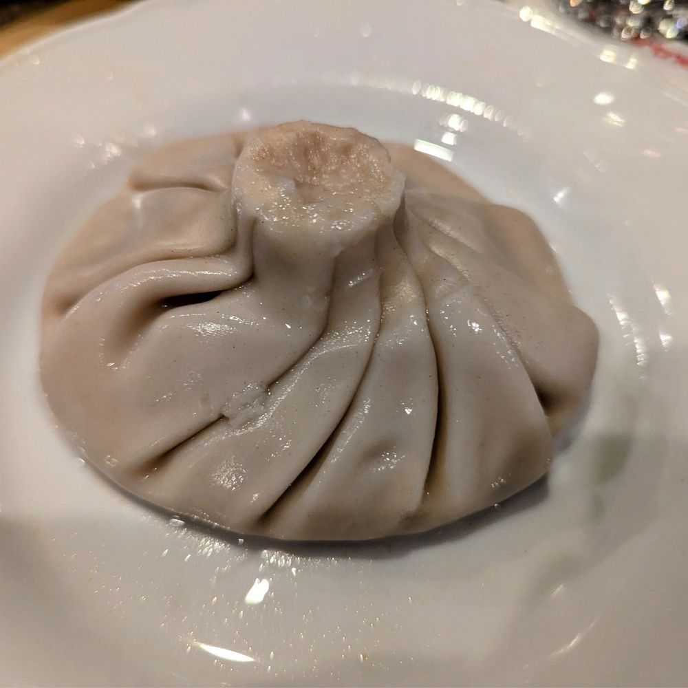 ARAGVI Restaurant - Khinkali is filled with meat and a broth.  Traditionally  pick it up and bite the top, then drink the broth, and then eat the dumpling. - Salad Near Me - PALATINE, Illinois