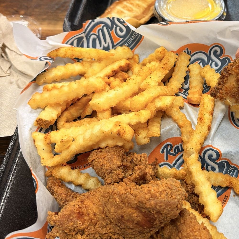 Chicken strips and fries with bread and sauces Chicken strips and fries with bread and sauces