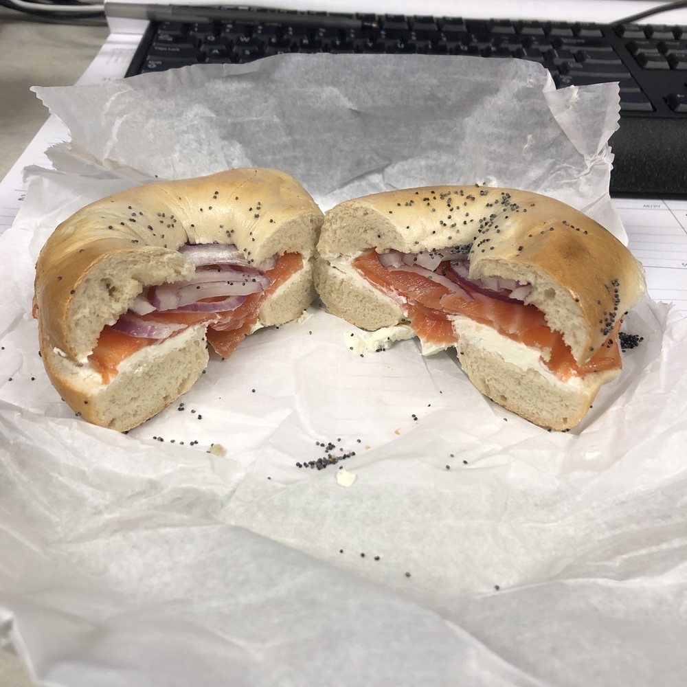 Bagel with cream cheese, lox and purple onion. Bagel with cream cheese, lox and purple onion.