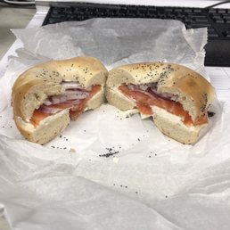 Bagel with cream cheese, lox and purple onion. Bagel with cream cheese, lox and purple onion.
