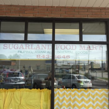 Sugarland Food Mart - storefront window with yellow curtains - Grocery Near Me - Parma, Ohio Sugarland Food Mart - storefront window with yellow curtains - Grocery Near Me - Parma, Ohio