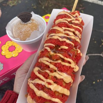 Mochi Lion - Half Mozzarella Rice Hot Dog with mango habanero sauce and siracha mayo and a trio of donuts. - Donuts Near Me - Riverside, California Mochi Lion - Half Mozzarella Rice Hot Dog with mango habanero sauce and siracha mayo and a trio of donuts. - Donuts Near Me - Riverside, California