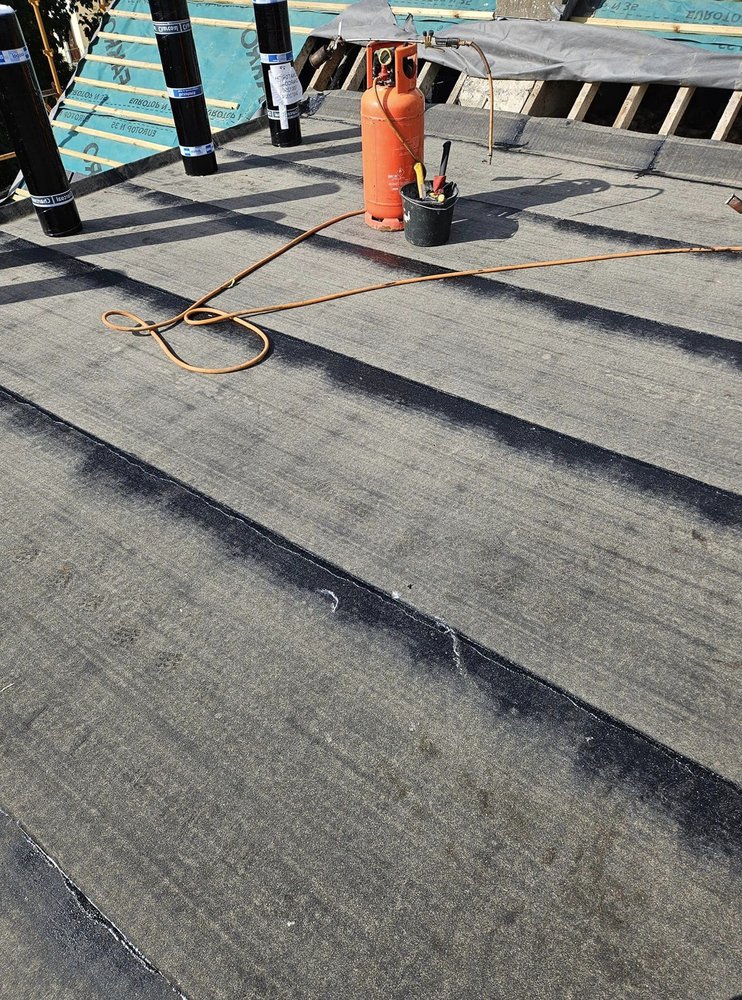 Slide of Pecan Park Roofing