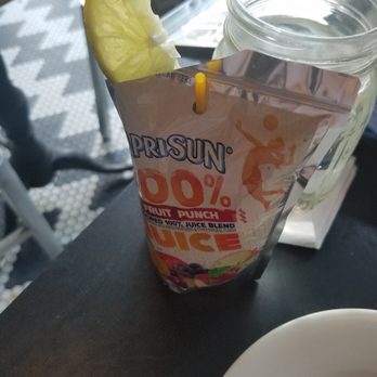 Mom's Kitchen & Bar - Caprisun drink. Don't get it if you like real drinks. It's lukewarm and just juice - Bars Near Me - Astoria, New York