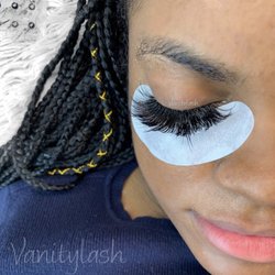Vanity Lash & Brow Bar - Closed eye view of a wispy volume set. Beautiful, natural lash line.