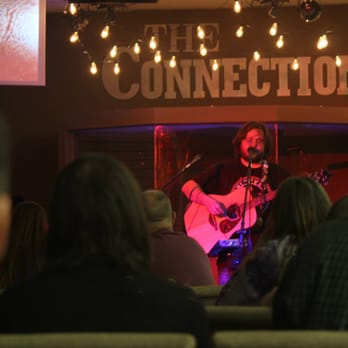 Coffee Connection - a man playing a guitar in front of a crowd - Coffee & Tea Near Me - Texas City, Texas Coffee Connection - a man playing a guitar in front of a crowd - Coffee & Tea Near Me - Texas City, Texas