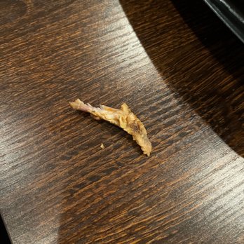 Two J's Grille - a piece of food on a table - Sports Bars Near Me - Murfreesboro, Tennessee