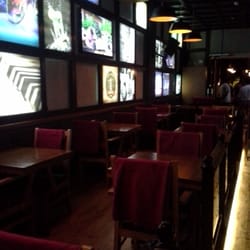 Wo-Wo Brasserie - Side tables on each side of the bar