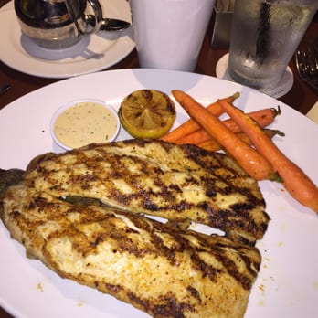 Seasons 52 - Rainbow trout with baby carrots - New American Near Me - Burlington, Massachusetts
