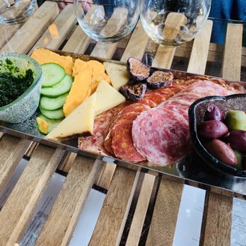 Caduceus Cellars - Cheese plate snack with various salamis, cheeses, olives, and bread - Wineries Near Me - Jerome, Arizona