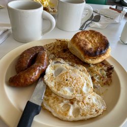 Bill's Family Restaurant - 2 egg breakfast with hash browns, link sausage and a biscuit.  With Coffee in the background.