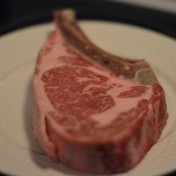 Le Marchand du Bourg - a piece of meat on a plate - Butcher Near Me - Montreal, Quebec Le Marchand du Bourg - a piece of meat on a plate - Butcher Near Me - Montreal, Quebec