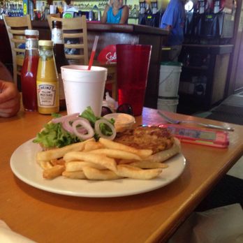 A-J's Dockside Restaurant - I think this is a crab cake sandwich.. Delicious sauce and tummy marg to go cup style! - Seafood Near Me - Tybee Island, Georgia A-J's Dockside Restaurant - I think this is a crab cake sandwich.. Delicious sauce and tummy marg to go cup style! - Seafood Near Me - Tybee Island, Georgia