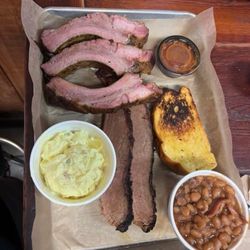 The Francis Smokehouse & Specialty Meats - Bbq ribs and brisket with baked beans and potato salad.