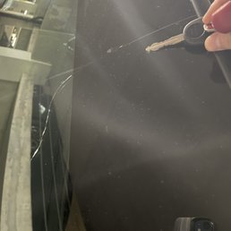 The chip and crack with the car key for scale.
