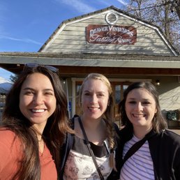 three women outside a winery three women outside a winery
