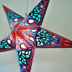 Divine Planet - Hanging paper star lanterns.