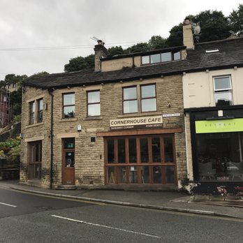 Corner House Cafe - Front view of the café and entrance. There's a parking lot on the other side of the street. - Cafes Near Me - Holmfirth, XWY Corner House Cafe - Front view of the café and entrance. There's a parking lot on the other side of the street. - Cafes Near Me - Holmfirth, XWY