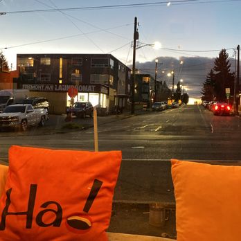 Ha! - a view of a street from inside a bus - Comfort Food Near Me - Seattle, Washington