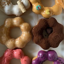 Coconut, mango, glaze, tiramisu, strawberry, blueberry mochi donuts Coconut, mango, glaze, tiramisu, strawberry, blueberry mochi donuts