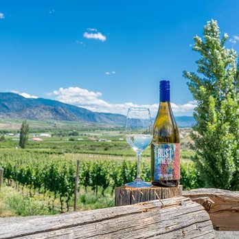 Rust Wine - a bottle of wine and a glass of wine - Wineries Near Me - Oliver, British Columbia Rust Wine - a bottle of wine and a glass of wine - Wineries Near Me - Oliver, British Columbia