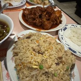 Shrimp with oyster sauce, spicy fried chicken wings, black bean noodles peeking in on the left and combo fried rice Shrimp with oyster sauce, spicy fried chicken wings, black bean noodles peeking in on the left and combo fried rice
