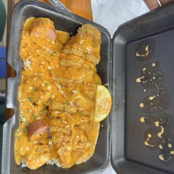 Underwater Seafood - Seafood dirty rice with spicy sauce and fried catfish