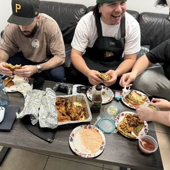 Carniceria Los Compadres - All In Barbershop enjoying the chicken whether it was for tacos or in a sandwich. - Meat Shops Near Me - Lynwood, California