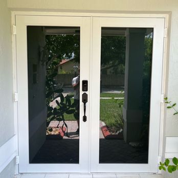 Venus Windows and Doors - Double French door retrofit for residential home. White frame. - Windows Installation Near Me - Miami, Florida Venus Windows and Doors - Double French door retrofit for residential home. White frame. - Windows Installation Near Me - Miami, Florida