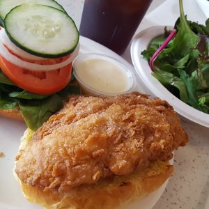Photo of Food Fair By Diego - Los Angeles, CA, United States. The Crispy Fish Sandwich! with extra-fresh lettuce &amp; crispy veggies and a secret sauce, plus a small salad. Great brioche bun, too. Yum!
