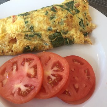 Killian Cafe & Grill - Spinach feta tomato omelet with a side of tomato instead of bread - Breakfast & Brunch Near Me - Miami, Florida Killian Cafe & Grill - Spinach feta tomato omelet with a side of tomato instead of bread - Breakfast & Brunch Near Me - Miami, Florida